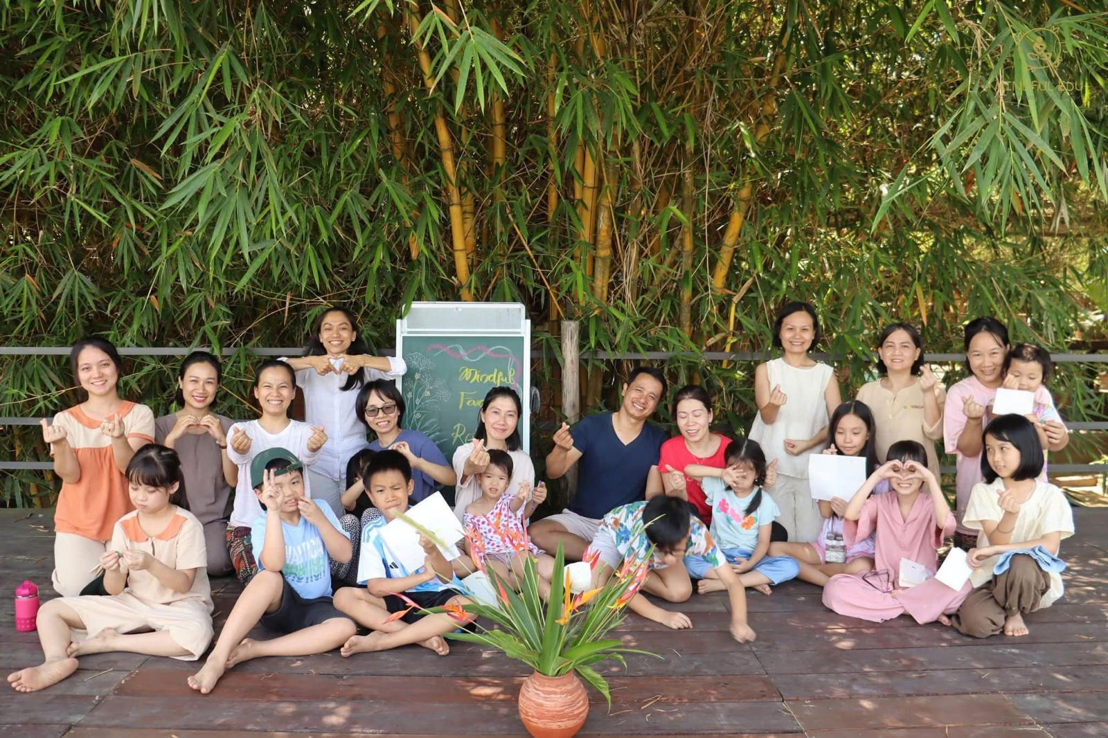 Mindful family retreat group photo with children