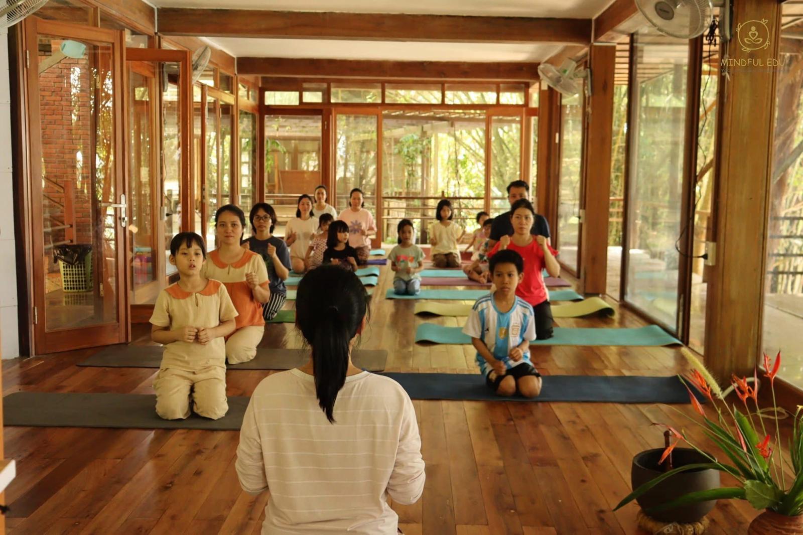 Mindful yoga and meditation class in the wooden pavilion