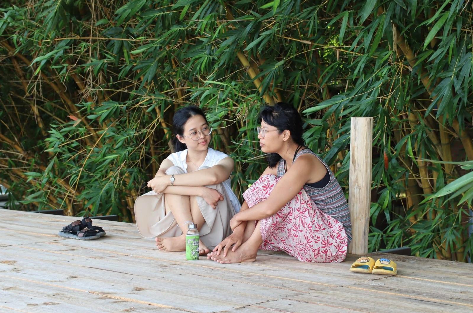 Guests resting on a bamboo deck