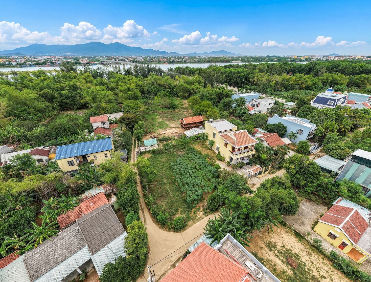 Triem Tay village and gardens with the mountains beyond