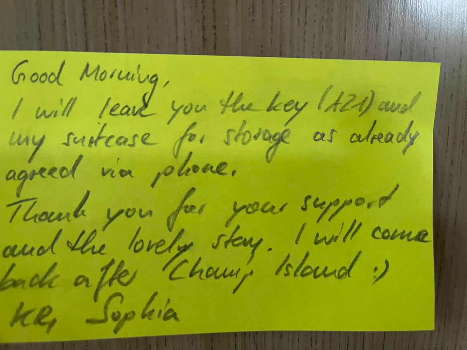 Yellow note left by a guest thanking the host for their support and stay