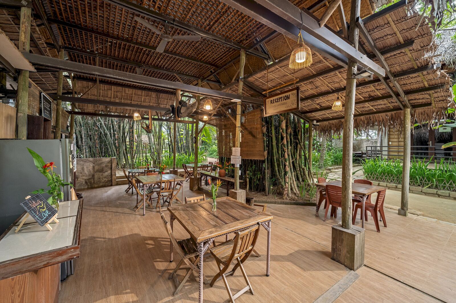 The open bamboo dining hall with its long shared tables